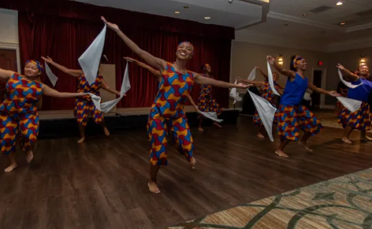 dancing women in African garb.