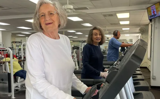 Active older adults or senior adults in gym on treadmills