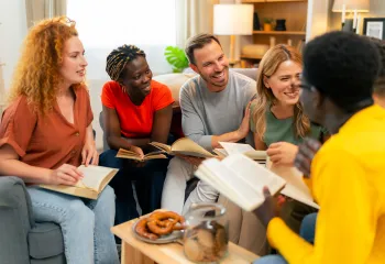 A diverse group of people attending a Bible study.