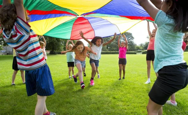 kids playing under big tent