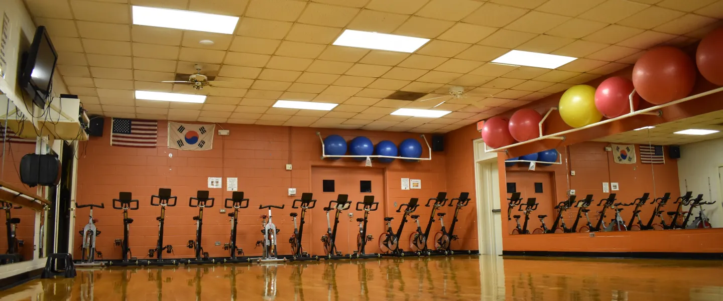 A group exercise room in the Reidsville YMCA. Stationary bikes sit near the wall.