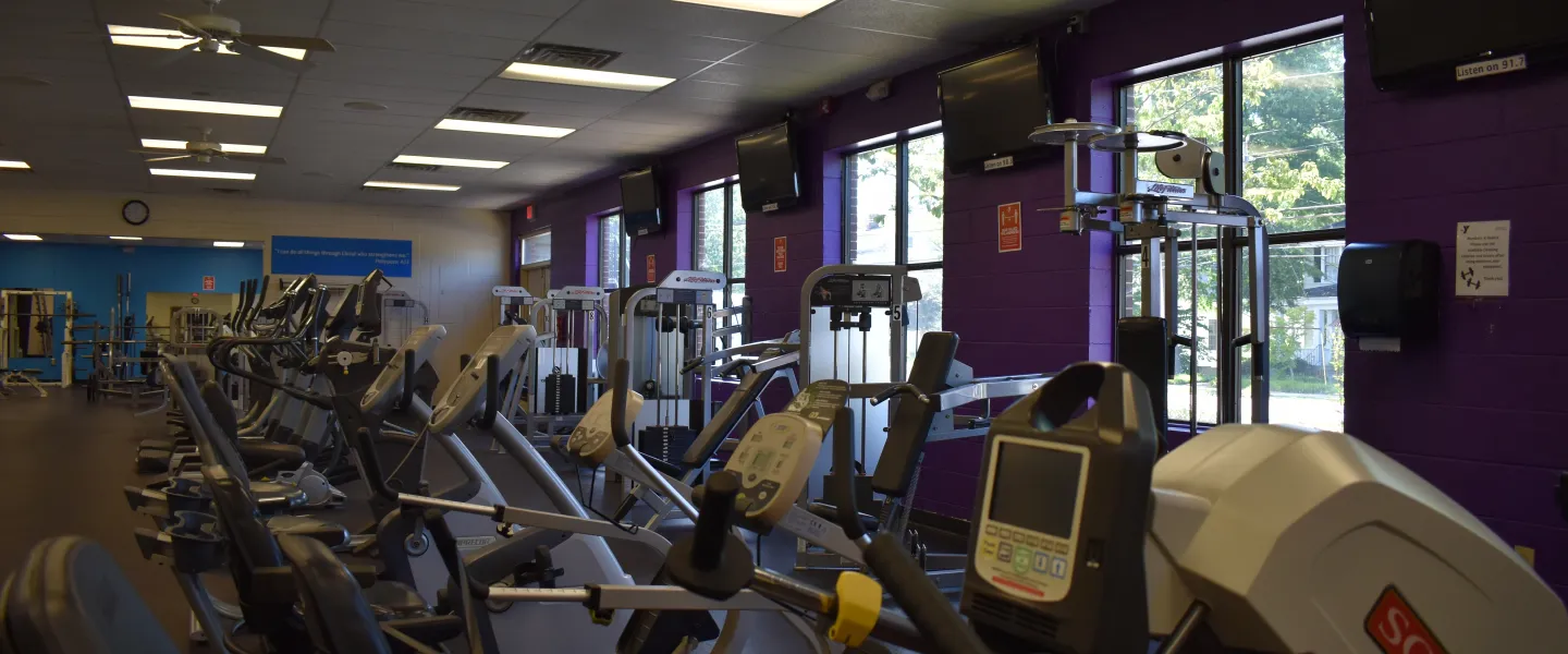 A photo of the Reidsville YMCA's fitness room. There are stationary bikes arranged in a row.