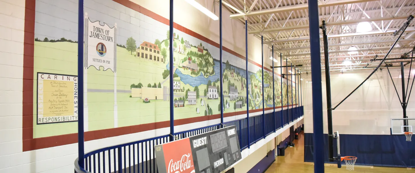 A photo of the Ragsdale YMCA's indoor track. It is overlooking the gym.