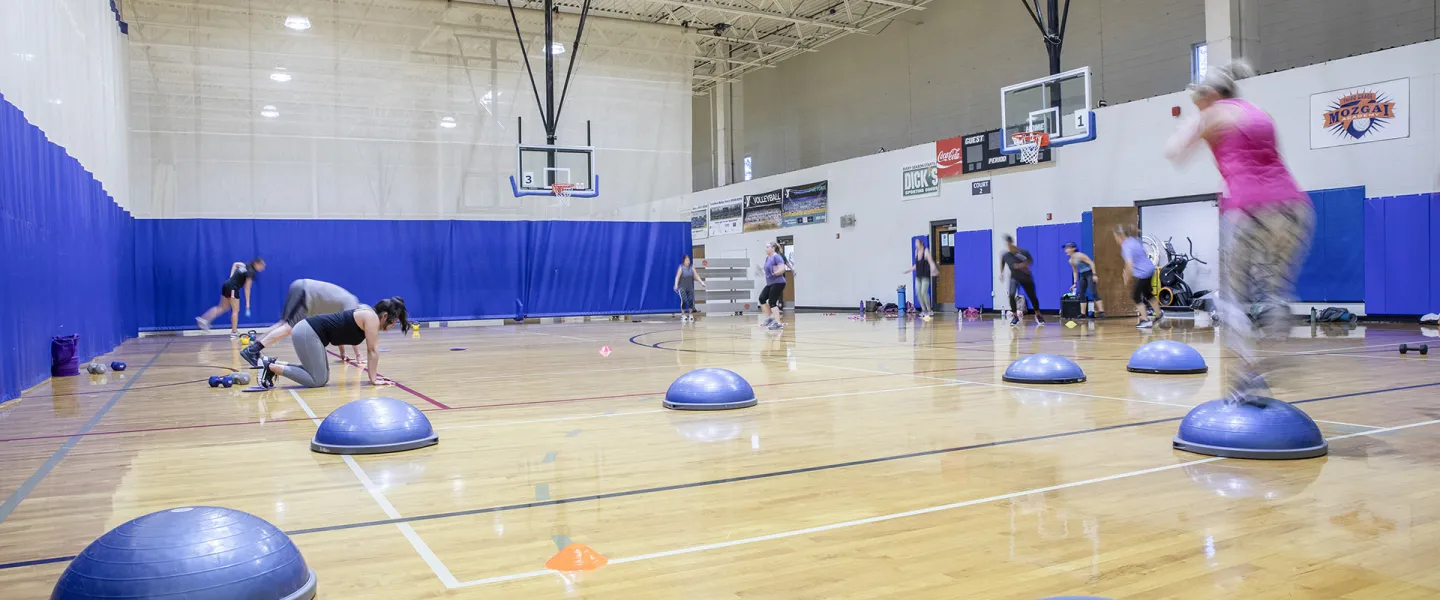 Group exercise class with equipment. 