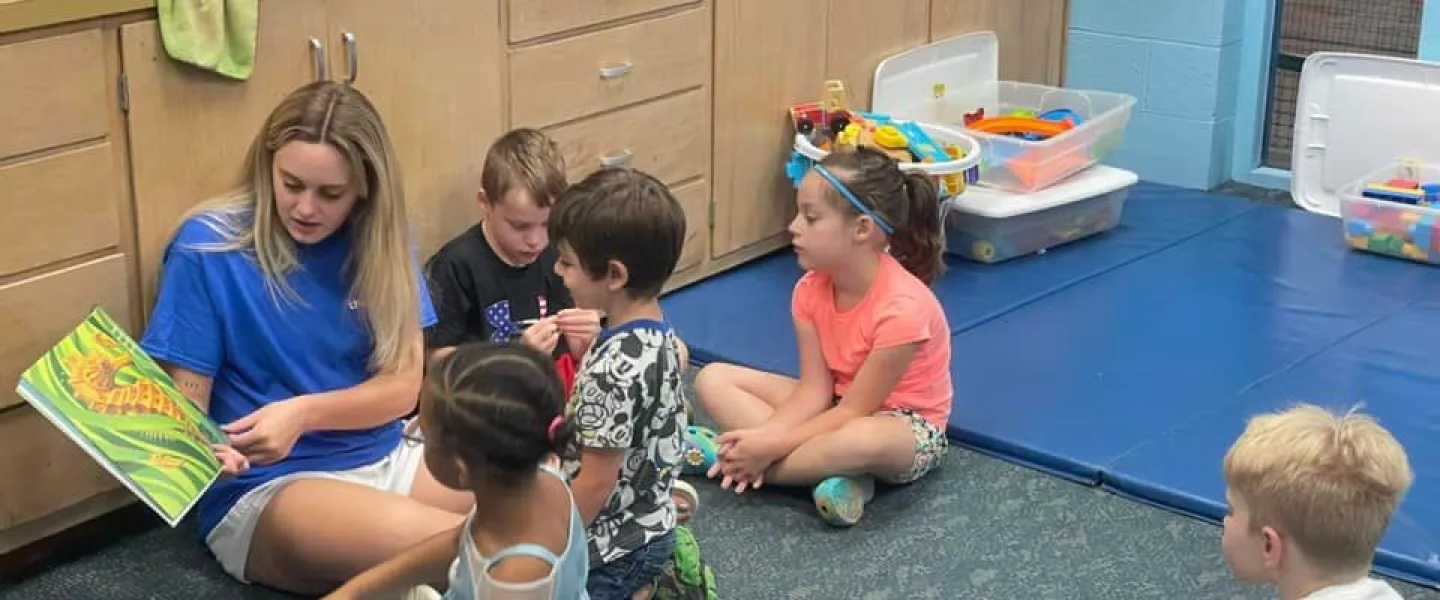 Campers reading a book