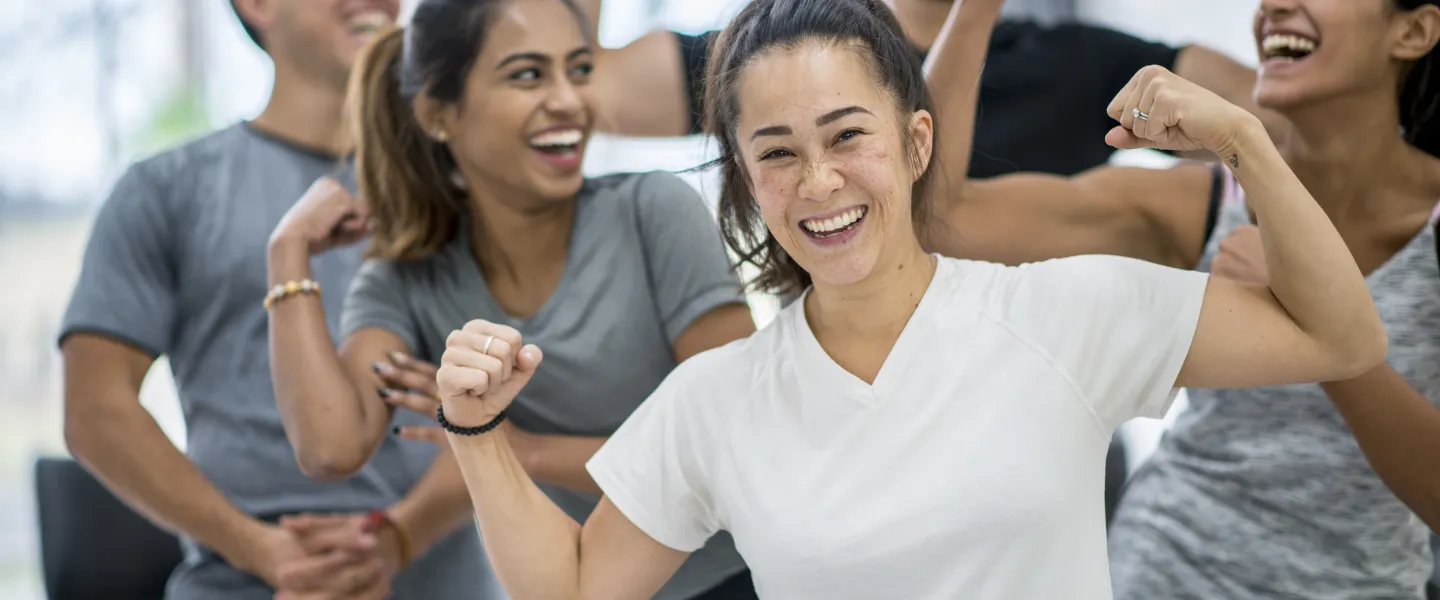 Happy people together in gym