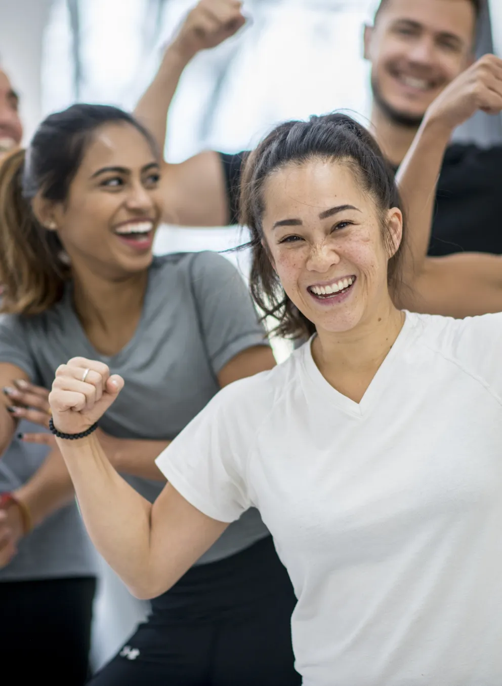 Happy people together in gym