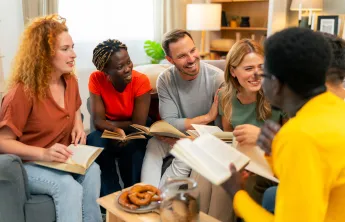 A diverse group of people attending a Bible study.