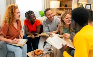 A diverse group of people attending a Bible study.