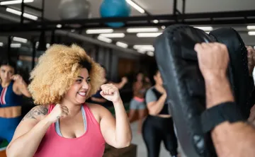 Woman in self defense class in gym